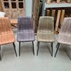 Stoelen Quebec, alle kleuren samen. Camel, grijs, groen en taupe. Stoffen stoel met 4 zwarte poten. Nu verkrijgbaar voor een kleine prijs bij Bouwie